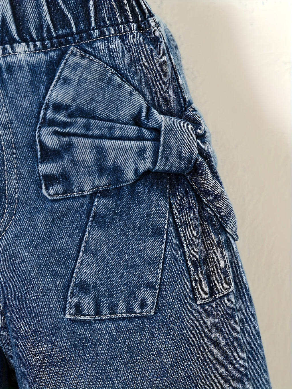 Girls' Wide Leg Denim Jeans in Washed Blue with Large Bow Details and Elastic Waist for Casual Outfits